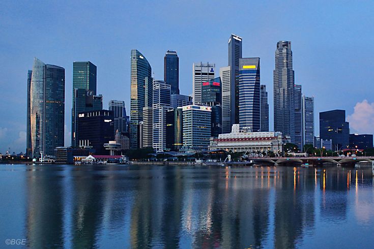 Singapore skyline reflected across Marina Bay